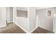 Upstairs hallway with carpet and access to bedrooms at 3728 Shimmering Creek Ave, North Las Vegas, NV 89031