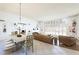 Bright dining area with large windows and a rustic wooden table at 3800 Euclid St, Las Vegas, NV 89121