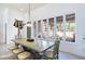 Elegant dining room with a farmhouse table and large windows at 3800 Euclid St, Las Vegas, NV 89121