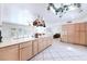 Modern kitchen with island, stainless steel appliances, and tiled floors at 3800 Euclid St, Las Vegas, NV 89121