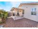 Covered patio with grill and desert landscaping at 3952 Moon Tango St, Las Vegas, NV 89129