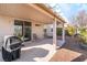 Covered patio with built-in BBQ and seating area at 3952 Moon Tango St, Las Vegas, NV 89129