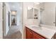 Simple bathroom with vanity, single sink and view to hallway at 3952 Moon Tango St, Las Vegas, NV 89129