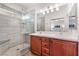 Bathroom with double vanity, large shower, and modern tile at 3952 Moon Tango St, Las Vegas, NV 89129