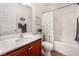 Clean bathroom with a tub shower combo and wood vanity at 3952 Moon Tango St, Las Vegas, NV 89129