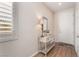 Entryway with console table, mirror, and wood-look flooring at 3952 Moon Tango St, Las Vegas, NV 89129