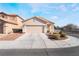 House exterior showing a two-car garage and well-maintained landscaping at 3952 Moon Tango St, Las Vegas, NV 89129