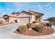 Single-story house with attached garage and landscaped front yard at 3952 Moon Tango St, Las Vegas, NV 89129