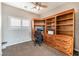 Home office with built-in wooden desk and shelving at 3952 Moon Tango St, Las Vegas, NV 89129