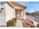 Front entrance with a security door and a small bench, surrounded by landscaping at 3952 Moon Tango St, Las Vegas, NV 89129