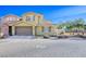 Charming two-story home featuring a neutral color scheme, well-manicured landscaping, and a two-car garage at 4 Via Centrale # 3, Henderson, NV 89011