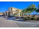 Exterior view of a two-story home with desert landscaping and stone pavers at 4 Via Centrale # 3, Henderson, NV 89011