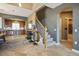 View of the living space with a staircase, kitchen, and entry into the home at 4 Via Centrale # 3, Henderson, NV 89011