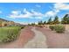 Landscaped community pathway with desert plants and a gravel trail at 4064 Emerald Wood St, Las Vegas, NV 89115