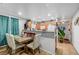 Dining area with wood table and chairs, adjacent to kitchen at 4064 Emerald Wood St, Las Vegas, NV 89115