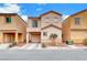 Two story house with tan exterior,balcony, attached garage, and landscaping at 4064 Emerald Wood St, Las Vegas, NV 89115