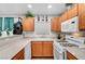 Kitchen with light wood cabinets, granite countertops, and white appliances at 4064 Emerald Wood St, Las Vegas, NV 89115