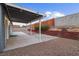 Covered patio, gravel yard, and brick retaining wall at 4083 Eileen St, Las Vegas, NV 89115