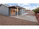 Covered patio and spacious backyard with gravel landscaping at 4083 Eileen St, Las Vegas, NV 89115