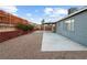 Covered patio, gravel landscaping, and a block wall at 4083 Eileen St, Las Vegas, NV 89115