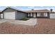 Gray house with a two-car garage and landscaped front yard at 4083 Eileen St, Las Vegas, NV 89115