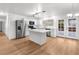 Modern kitchen with island, stainless steel appliances, and white cabinets at 4083 Eileen St, Las Vegas, NV 89115