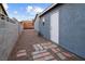 Side yard with gravel and a pathway to the back at 4083 Eileen St, Las Vegas, NV 89115