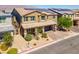 Two-story house with solar panels and a paved driveway at 4128 Fossatello Ave, North Las Vegas, NV 89084