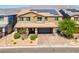 Two-story house with solar panels and a paved driveway at 4128 Fossatello Ave, North Las Vegas, NV 89084