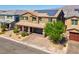 Two-story house with solar panels and a paved driveway at 4128 Fossatello Ave, North Las Vegas, NV 89084