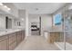 Bathroom with double vanity, granite countertops, and view to bedroom at 4128 Fossatello Ave, North Las Vegas, NV 89084