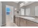 Double vanity bathroom with granite countertop and ample storage at 4128 Fossatello Ave, North Las Vegas, NV 89084