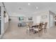 Open dining area with table and chairs, view to living room at 4128 Fossatello Ave, North Las Vegas, NV 89084