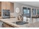 Modern kitchen with stainless steel appliances and granite countertops at 4128 Fossatello Ave, North Las Vegas, NV 89084