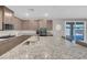 Modern kitchen with stainless steel appliances and granite countertops at 4128 Fossatello Ave, North Las Vegas, NV 89084