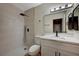 Modern bathroom featuring a walk-in shower, sleek vanity, and contemporary fixtures at 413 N Lamb Blvd # E, Las Vegas, NV 89110