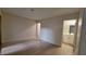 Neutral bedroom featuring wood-style flooring and adjacent bathroom and closet doors at 413 N Lamb Blvd # E, Las Vegas, NV 89110