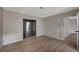 A bright bedroom with wood floors, a neutral color scheme and sliding glass doors at 413 N Lamb Blvd # E, Las Vegas, NV 89110