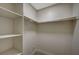 Walk-in closet featuring bright lighting and built in shelving and clothing racks at 413 N Lamb Blvd # E, Las Vegas, NV 89110