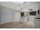 Bright, modern kitchen features white cabinetry, stainless steel appliances, and light wood flooring at 413 N Lamb Blvd # E, Las Vegas, NV 89110