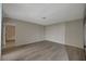 Large living room featuring contemporary wood flooring and access to hallway at 413 N Lamb Blvd # E, Las Vegas, NV 89110