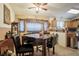 Dining area features a granite table and four leather chairs at 4314 Flaming Ridge Trl, Las Vegas, NV 89147