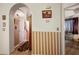 Bright hallway with decorative wall and wood-look flooring at 4314 Flaming Ridge Trl, Las Vegas, NV 89147