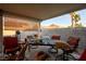 Covered patio with seating area, perfect for outdoor entertaining at 4314 Flaming Ridge Trl, Las Vegas, NV 89147