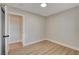 Bedroom with wood-look flooring, an open doorway, and neutral walls, providing a clean and versatile layout at 4512 Mark Ave, Las Vegas, NV 89108