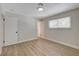 Inviting bedroom with wood-look floors, ample lighting, and a large window, creating a warm and welcoming atmosphere at 4512 Mark Ave, Las Vegas, NV 89108