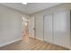 Bedroom featuring closet with sliding doors and light wood-look flooring at 4512 Mark Ave, Las Vegas, NV 89108