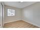 Bedroom with laminate flooring, a large window, and a closet with sliding doors at 4512 Mark Ave, Las Vegas, NV 89108