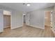 Bedroom with light wood-look floors and three entry ways at 4512 Mark Ave, Las Vegas, NV 89108