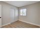 Cozy bedroom with new floors, closet with sliding doors and a bright window at 4512 Mark Ave, Las Vegas, NV 89108